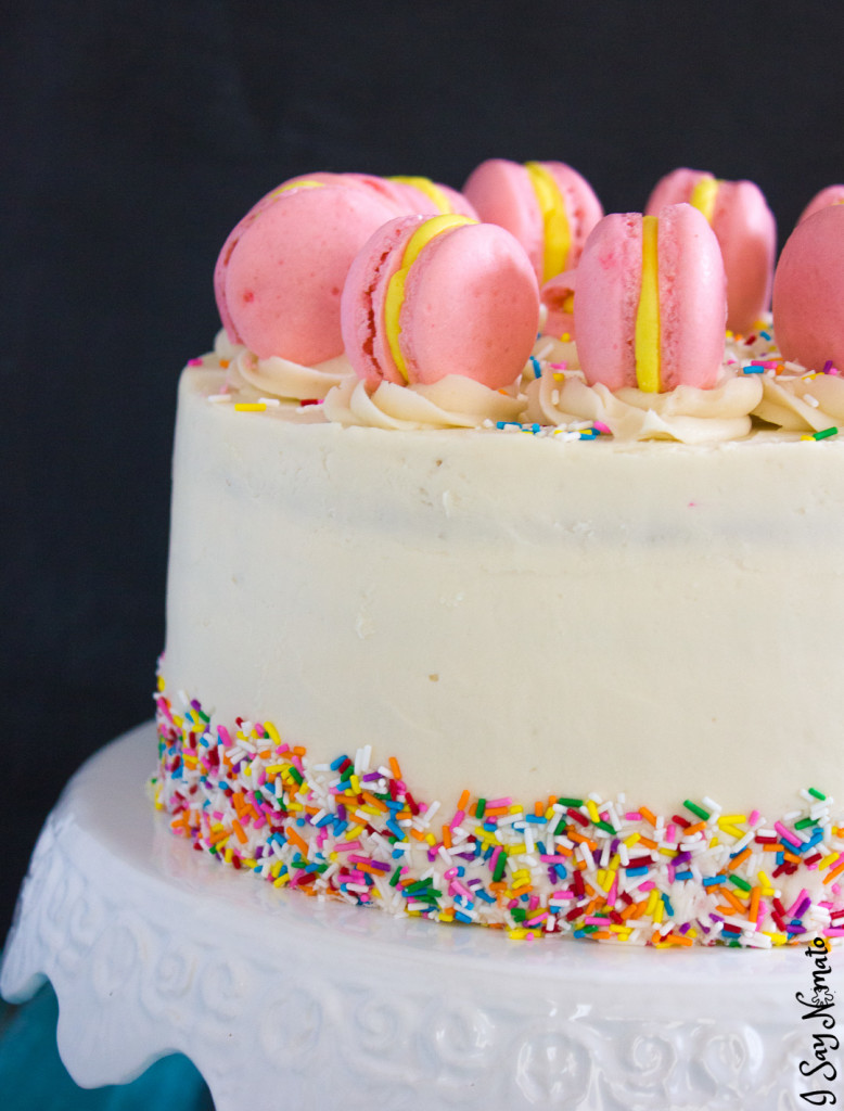 Have you ever seen happier cake? Vivid ombre pink lemonade layers with sprinkles and macarons!