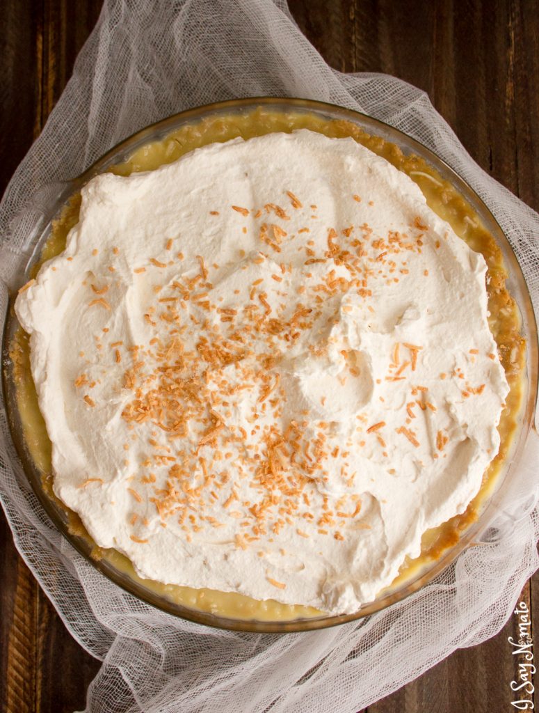 This Coconut Cream Pie with is a twist on a classic. Hearty coconut cream filling topped with whipped cream and toasted coconut, all on top of an oatmeal cookie crust for a little added crunch! 