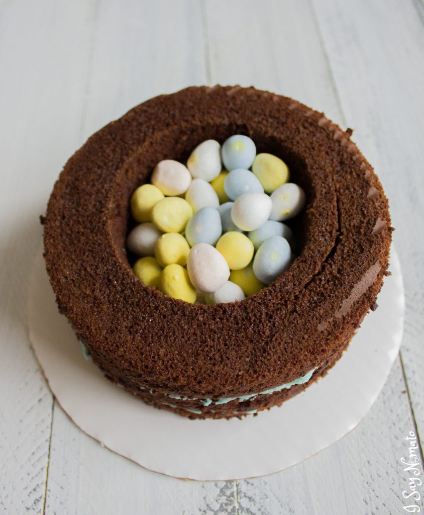 This beautiful Cookies and Cream Cake has a secret spring surprise inside! Made with rich chocolate cake and vanilla buttercream, crushed Oreos add the beautiful effect to this spring speckled egg cake. 