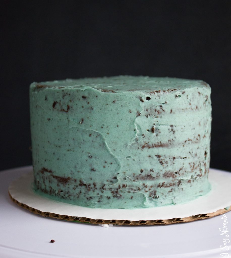 This beautiful Cookies and Cream Cake has a secret spring surprise inside! Made with rich chocolate cake and vanilla buttercream, crushed Oreos add the beautiful effect to this spring speckled egg cake. 