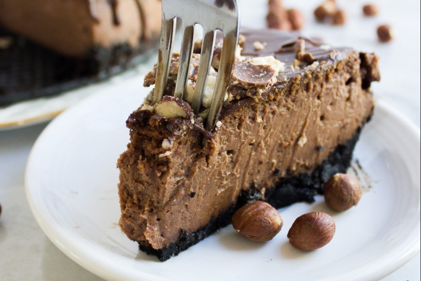 Indulge yourself with this ridiculously smooth and creamy Chocolate Hazelnut Cheesecake. Made with a full jar of Nutella and topped with crumbled Fererro Rocher, it is a chocolate-hazelnut lover's paradise!
